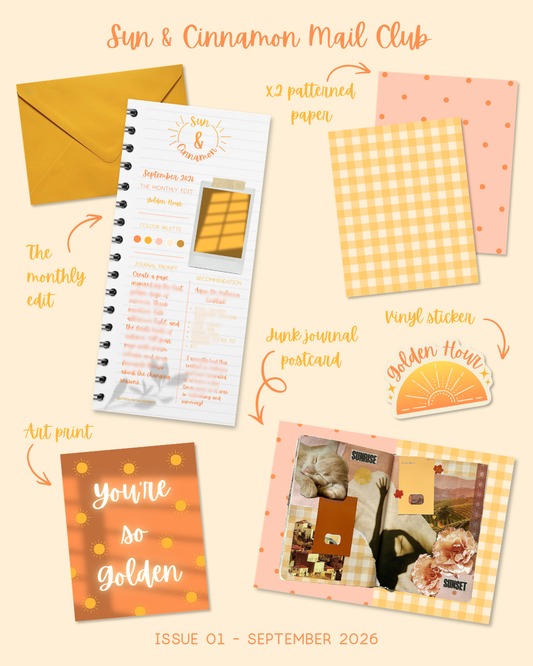 A styled flat lay of a 'Sun & Cinnamon Mail Club' journaling kit, Issue 01, September 2026. The kit includes a yellow envelope, a spiral-bound monthly edit letter, patterned paper sheets, a vinyl sticker, an art print, and a collage journal postcard, all arranged on a warm cream background with handwritten labels pointing to each component.